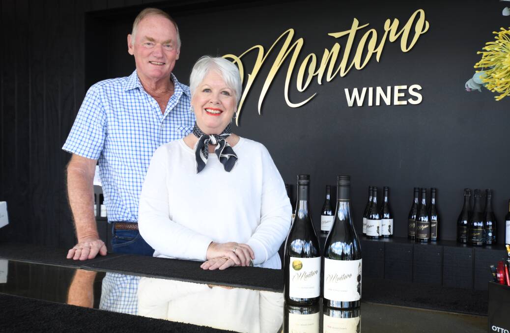 NICE SPICE: Bob and Jennifer Derrick with their award-winning vintages of Montoro's Pepper Shiraz. Photo JUDE KEOGH 