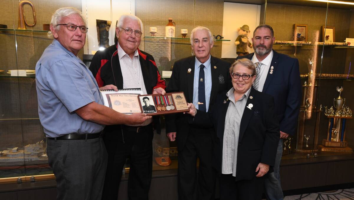FAMILY TIES: Graham and Robert Flood with OESC directors Terry Flood AND Ros Davidson (RSL) and RSL Orange sub-branch vice president Brad Bliss. Photo JUDE KEOGH