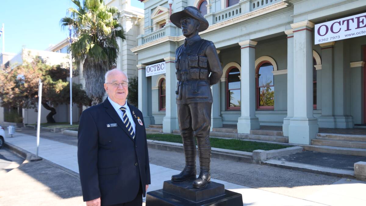 BACK TO NORMAL: RSL Orange Sub Branch president Chris Colvin stands at the statue of Private John Patrick Hamilton VC. This year's Anzac Day march will be back to normal after COVID restrictions for the past two. Photo JUDE KEOGH