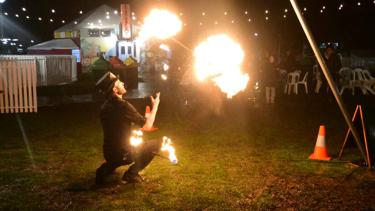 HOT AUGUST NIGHT: The Fire Guy, Andrew Targett, entertains during the Winter Fire Festival events at Robertson Park. Photo JUDE KEOGH