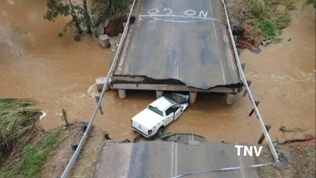 WATER FORCE: The Nangar Road was closed at Nyrang Creek after the bridge collapsed. It is believed the driver escaped injury. Photo TROY PEARSON/TNV