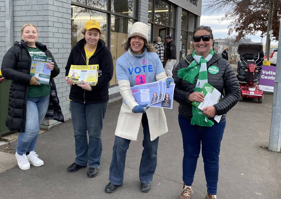 ALMOST THERE: Ella Bowman (The Nationals Andrew Gee), Fiona Knight (United Palmer Party, Adam Jannis), Cathy Bloomfield (Independent Kate Hook) and Rebecca Ilveen (The Greens' Kay Nankervis) hand out how-to-vote leaflets on Friday.