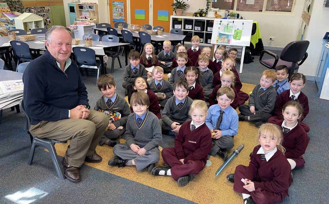 CLASS OF HIS OWN: Catherine McAuley Principal Michael Croke, pictured with Kindergarten Blue, will retire at the end of the year. Photo KATE BOWYER