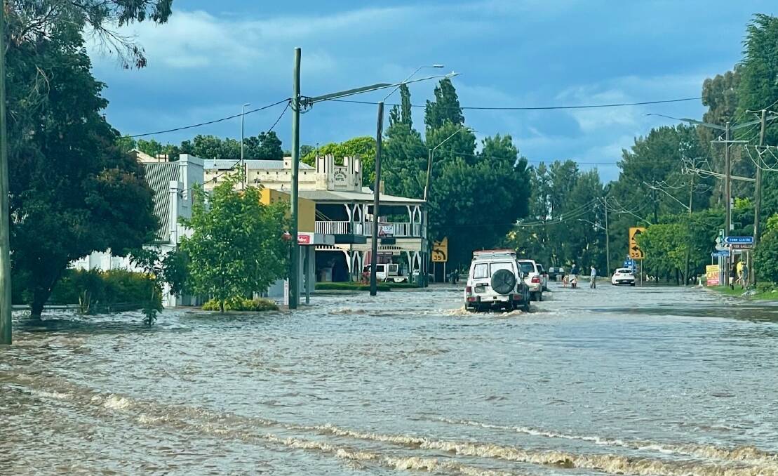 WATER VIEW: The Mitchell Highway, also known as Watson Steet, was under water on Friday afternoon after a heavy downpou hit the Molong district. Photo JODIE OXMAN