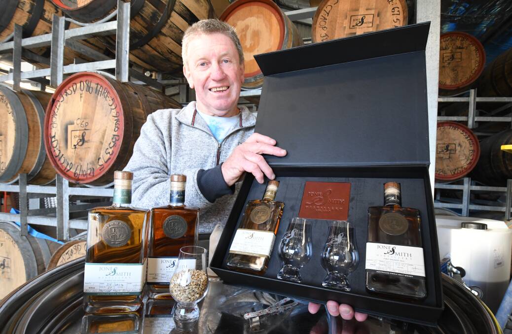 GOOD SPIRITS: Tony Jones with Jones & Smith Distillery's two single malt whiskys. Photo JUDE KEOGH