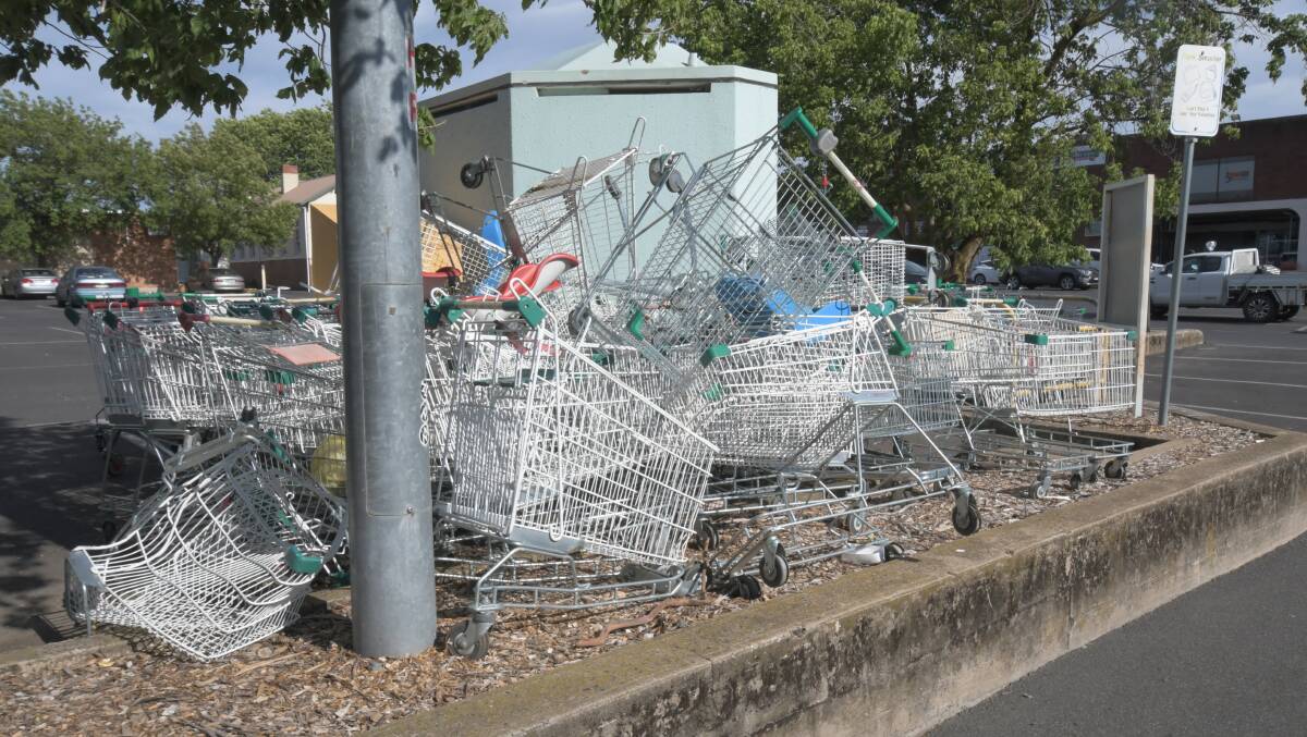 MANGLED MESS: One of the piles of disused trolleys in the Woolworth's car park. Photo CARLA FREEDMAN