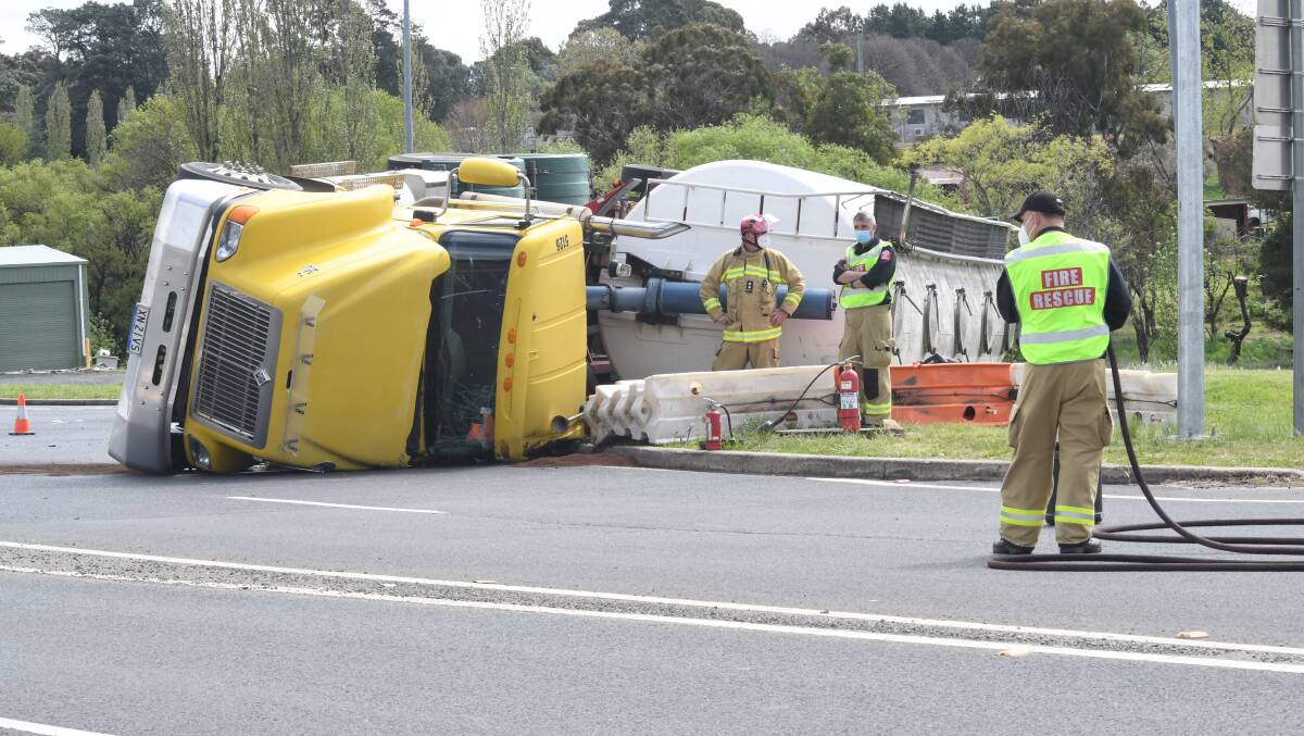 ROLL OVER: Police have blocked a lane of the Northern Distributor Road following a semi trailer rollover. Photo JUDE KEOGH