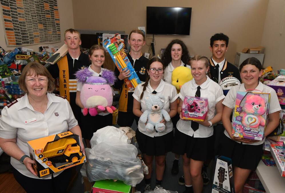 TOY TIME: Major Kate Young and Orange High School's Jackson Hill, Ella Lamrock, Jake Haydon, Mackenzie Smith, Clare Mansfield, Ruby Owens, Mack Selwood and Cennedi Dally. Photo JUDE KEOGH 