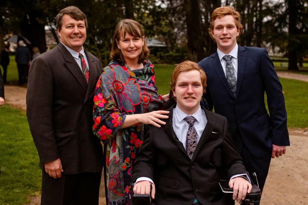 Dux of 2022, Harrison Crisp (front) at KWS Year 12 Graduation Ball, with his parents Roger Crisp and Anthea McClintock, and twin brother James Crisp. Picture by Laura Cole Photography.