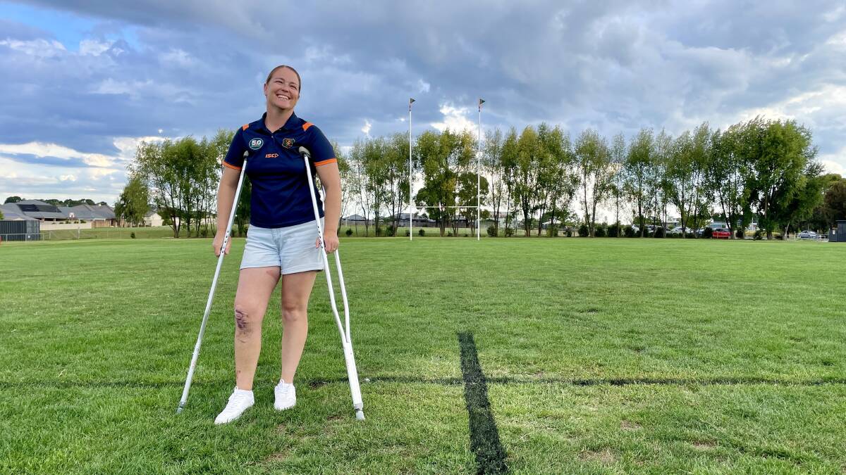 Orange City Rugby Union Club player, Karina Kiley eight days after knee surgery on crutches at her club's home ground. Picture by Emily Gobourg.