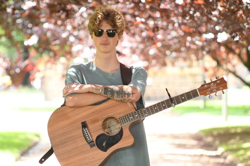 HITTING THE GROUND STRUMMING: 19-year-old emerging musician, James Sutherland directs all proceeds to mental health research as he gets ready to perform first headline show at Mortimers Wines on January 22. Photo: JUDE KEOGH.