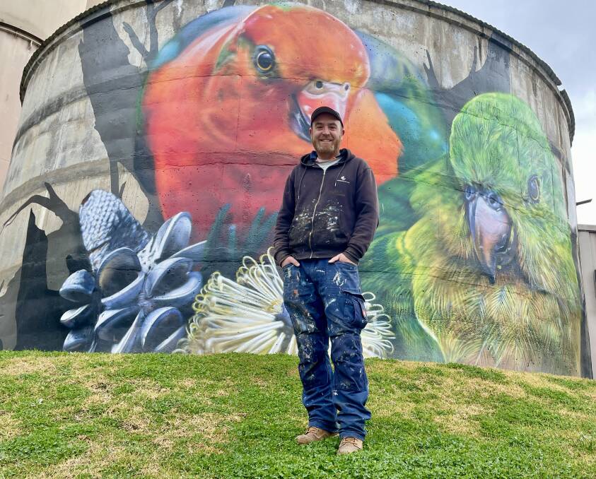 ICONIC: Monash graphics graduate and renowned Melbourne street artist, Jimmy Dvate jumped at the chance to transform the Manildra Group's wall and water tank, saying it was a 'rewarding' thing to do. Photo: EMILY GOBOURG.