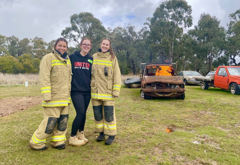 FLAMING WIN: OHS Students Clare McMillan, Izzy Back and Abby Sell are 'definitely' considering roles in the firefighting ranks now, with Girls on Fire a 'big eye-opener'. Photo: EMILY GOBOURG.