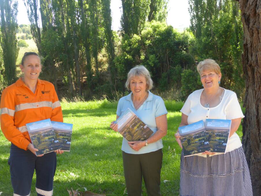 OFF THE GROUND: Newcrests Nicole Morris with GrowMolong group's Julie Dean and Viv Sharpless proudly displaying copies of the towns' new cookbook, which are now available for sale. Photo: SUPPLIED.