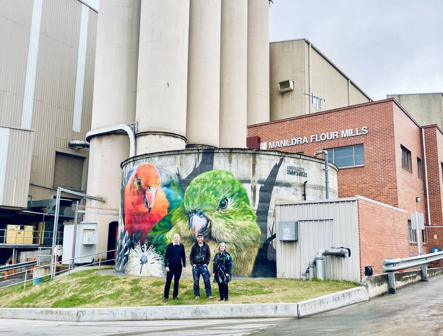 ON THE MAP: Manildra Flour Mills' site manager, John Gorringe with Mebourne artist, Jimmy Dvate and Cabonne's Sue Reynolds in front of the new art murals in the small town. Photo: EMILY GOBOURG.