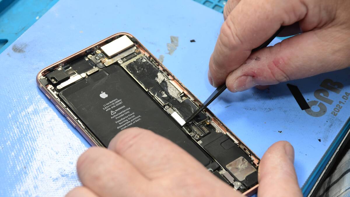 Orange-based phone repair technician, owner of MePhone Keith Rogers says the right to repair laws needs more support from big tech giants. Picture by Jude Keogh.