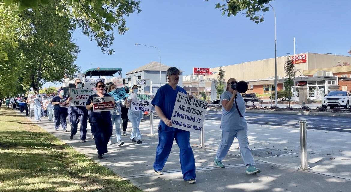 HEAR THEM ROAR: Nurses and midwives displayed signage such as 'stop telling us to cope' and 'if the nurses are outside, something is wrong on the inside'. Photo: EMILY GOBOURG.