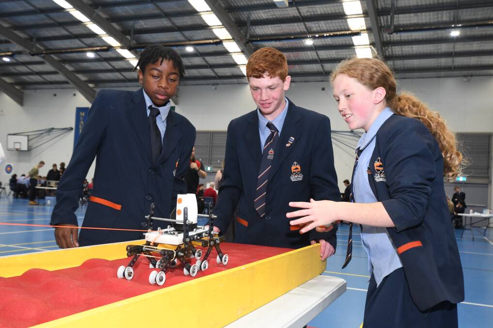 STEM CHALLENGERS: Students from Orange Anglican Grammar School, Tanatswa Matavire, Archie Casey, and Rebecca Kemp with their 'Mars Rover' model. Photo: JUDE KEOGH.