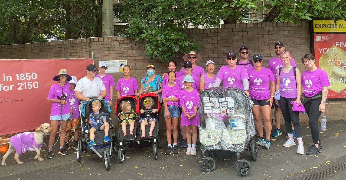 COMMUNITY EFFORT: Group shot of the co-walkers from Glenn's Push from the Bush campaign on the last day of the monster marathon walk in Randwick. Photo: SOPHIE COTTON SMITH.