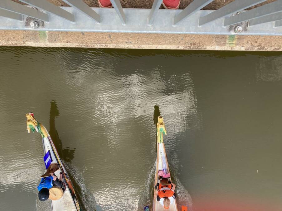 BY A DRAGON's NOSTRIL: An aerial look at the closely run Bridge to Bridge Classic won by Colour City Dragons, depicted in orange uniforms to the right. Photo: CONTRIBUTED.
