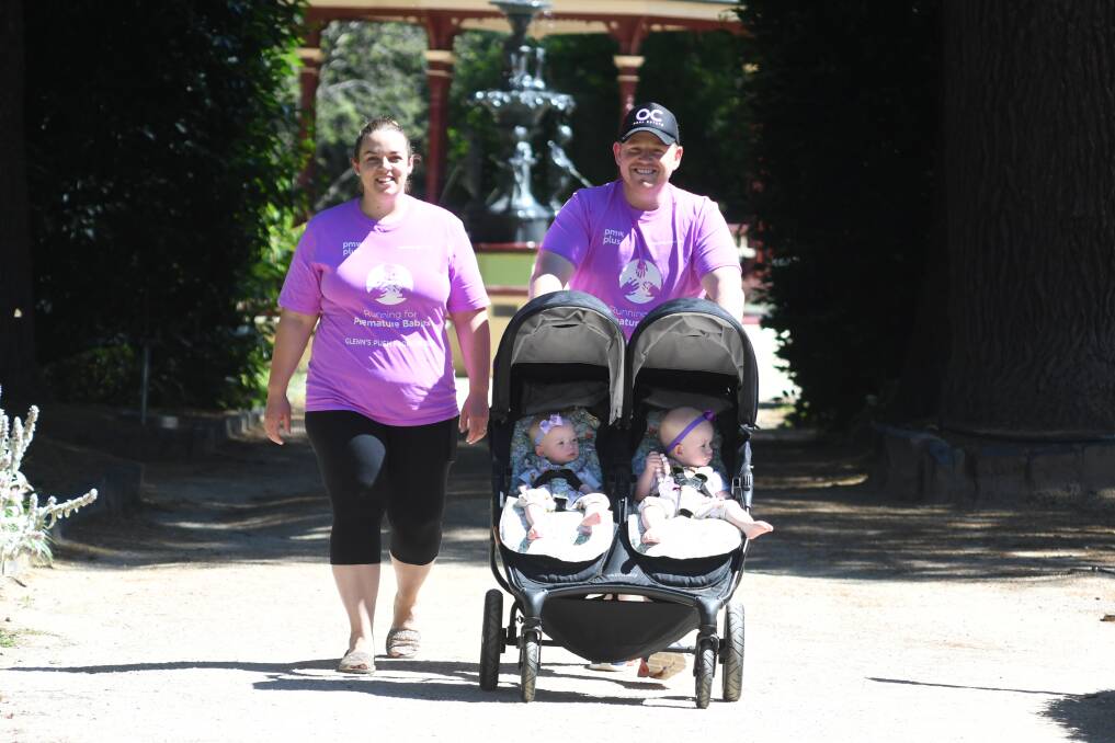 MISSION-GOERS: Super-parents, Renee and Glenn Atkinson with their twin girls, Eleanor and Zoe, have managed to raise a whopping $200k to score life-saving equipment for prematurely-born babies in Orange and Randwick. Photo: JUDE KEOGH.