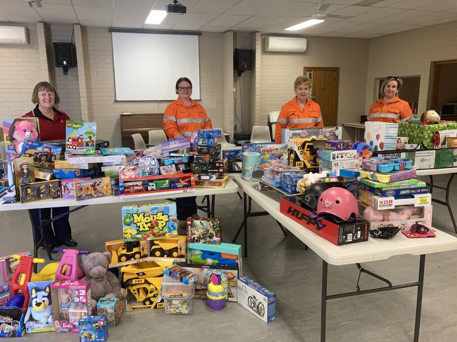 CADIA DUG DEEP FOR SALVOS: Salvation Armys Major Kate Young joined by Cadia crew members Angie Caffin, Suzanne Gaffney and Kellie Hughes in their gift delivery for the Salvos annual toy drive. Photo: SUPPLIED.