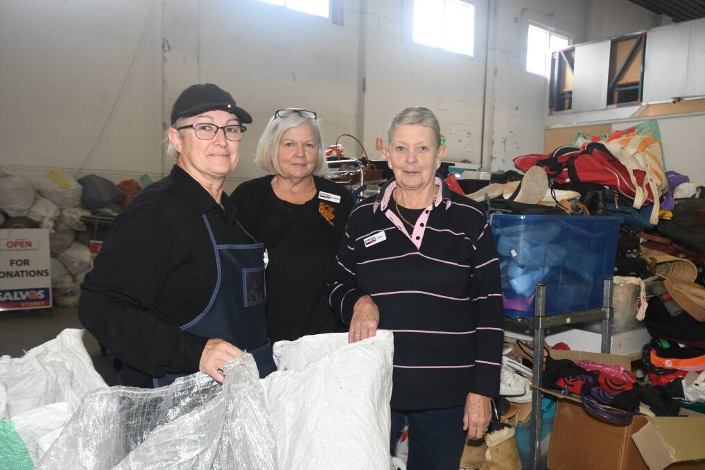 SCARCE: Orange Salvos store volunteer, Kari Olariaga with acting store manager, Sharon Lord and Salvos volunteer, Nerida Noon continue to work voluntarily, despite the fall in unpaid work figures. Photo: CARLA FREEDMAN.
