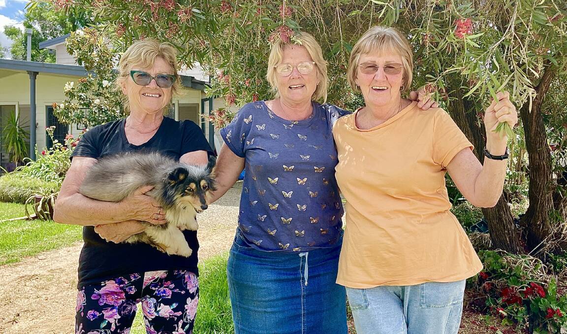 Eugowra's Carol Monahan with neighbours of three decades, Marianne Skeers and Liz Adams, who talk of record flooding, ongoing recovery, and the power of friendship. Picture by Emily Gobourg.