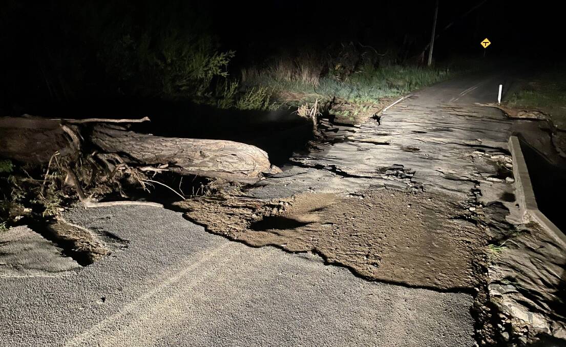 Extensive road damage just outside of Orange on Sunday, caused from heavy rainfall across the Central West. Picture by William Davis.