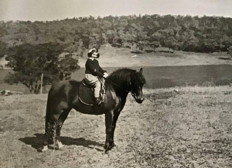 A six-year-old Margie Hamilton (nee), riding 'Patsy' to Murga Public School in 1955. Picture supplied.