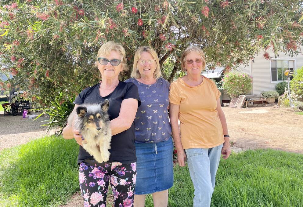 Eugowra's Carol Monahan with neighbours of three decades, Marianne Skeers and Liz Adams, who talk of record flooding, ongoing recovery, and the power of friendship. Picture by Emily Gobourg.