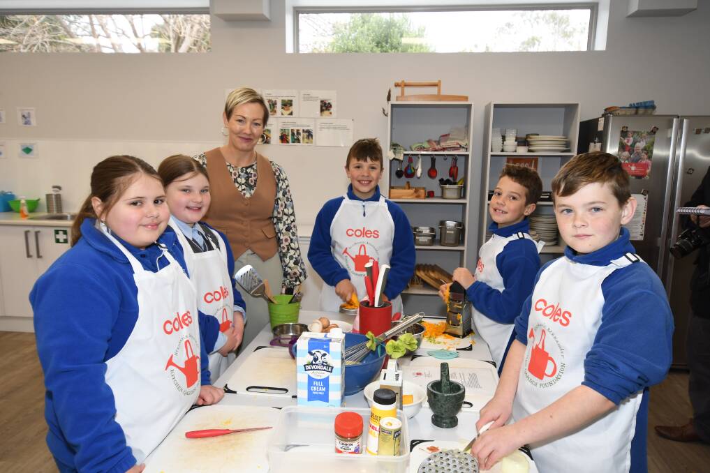 FRESH KITCHEN: Students Halle Trudgett and Aria Cartwright with Calare Public School's deputy principal, Joy Harvey and Charlie Law, Levai Stowers and Archie Nichols in the new kitchen building. Photo: CARLA FREEDMAN.

