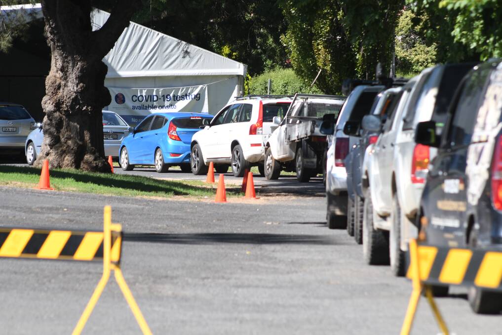CITY QUEUES: The line-up for testing at Wade Park's testing clinic in Orange at 10am this morning steadily grew, as the city reported * cases in the last 24-hour period. Photo: JUDE KEOGH. 