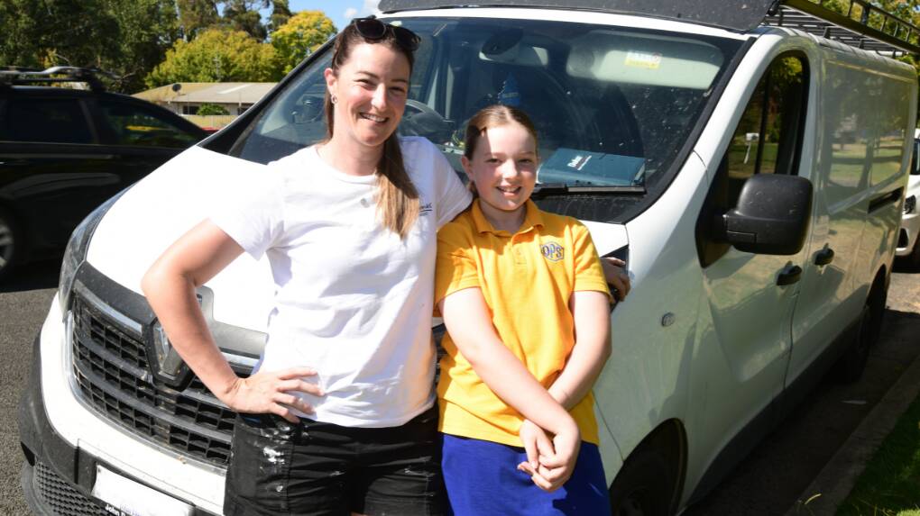 Daughter Lexi McLennan with her mum, Tahlia Williams of Tahlia Maree Painting & Decorating, at the work van in Orange. Picture by Jude Keogh.