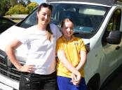 Daughter Lexi McLennan with her mum, Tahlia Williams of Tahlia Maree Painting & Decorating, at the work van in Orange. Picture by Jude Keogh.