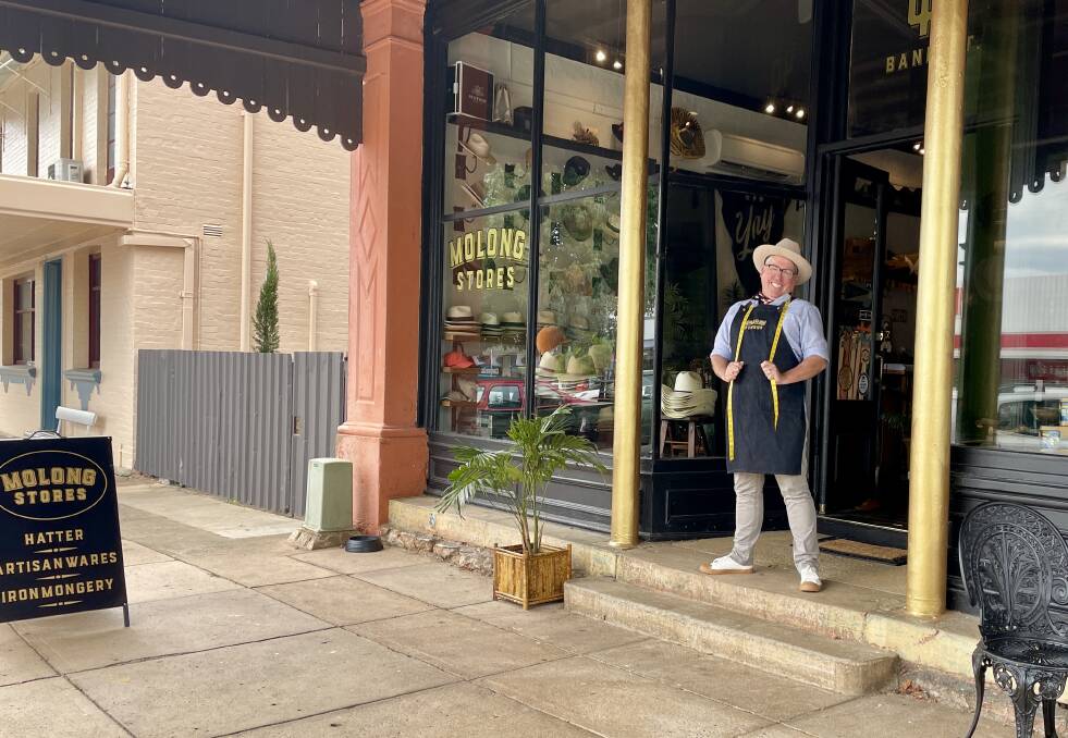 MORE TO COME: Hat-lover, Robbie Carroll at his Molong Stores business, 40 Bank Street - a heritage hub with 'watch this space' tagged to its bricks. Photo: EMILY GOBOURG.