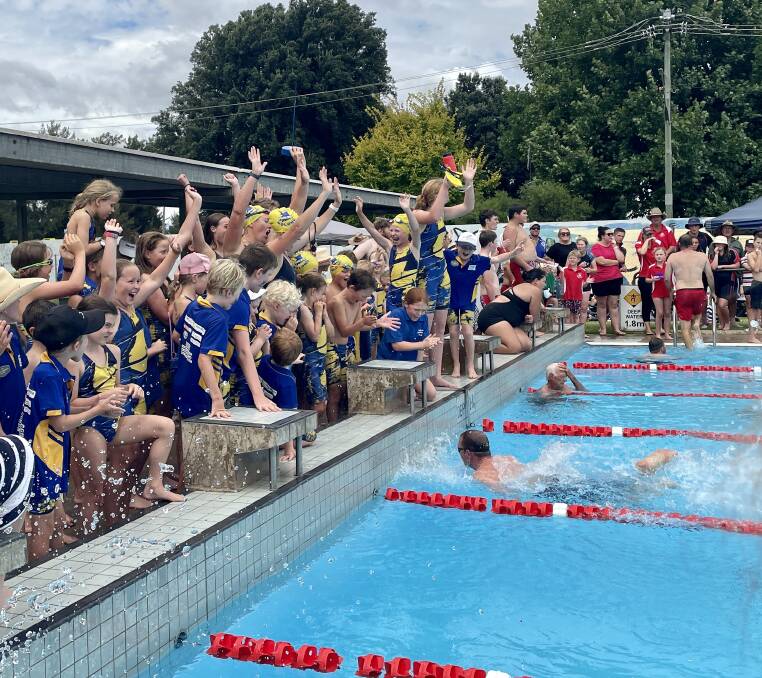 WAR CRIES: Molong's swimming pool rang with deafening cheers during its last fun event on Saturday, the parents race. Photo: EMILY GOBOURG.