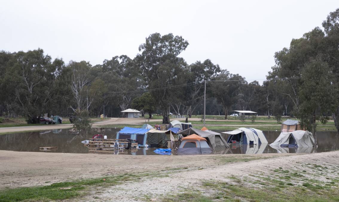 Abandoned Wilks Park tents in floodwaters. Picture: Madeline Begley
