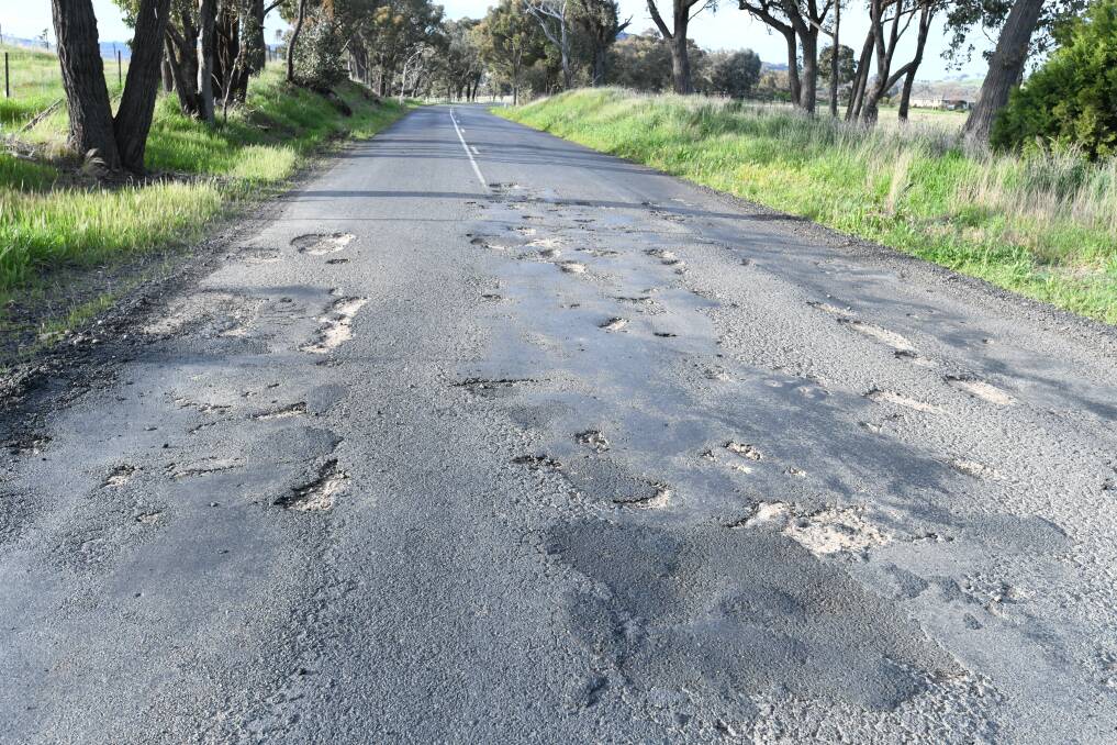 Potholes on Cargo Road near Orange. Picture by Jude Keogh. 