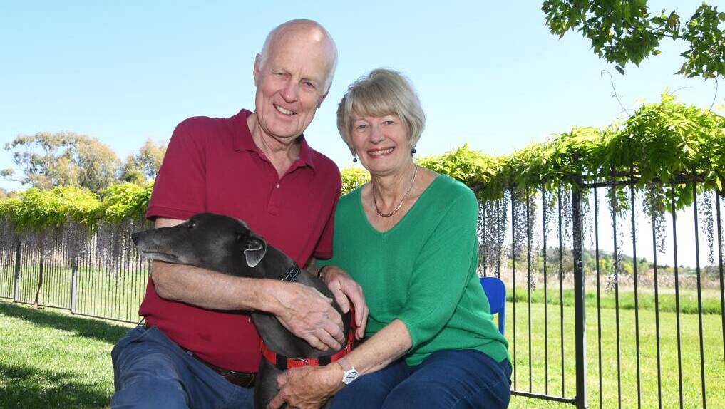 Neil Jones and Libby Jones with greyhound Rosie in Orange. Picture by Carla Freedman 