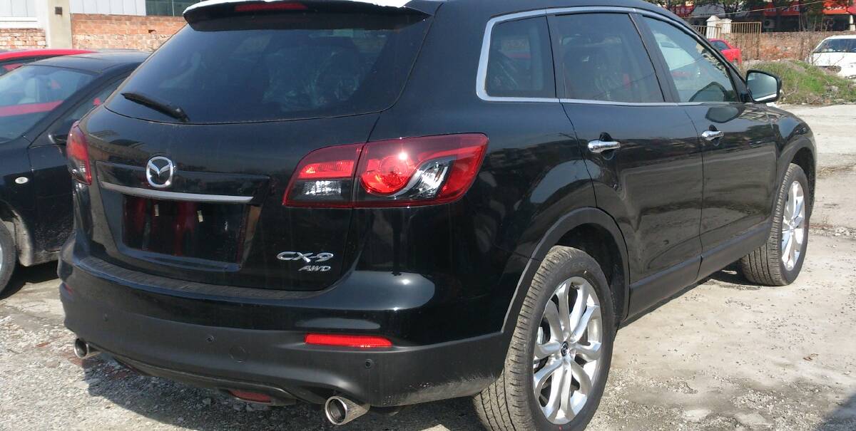Black Mazda CX9 SUV, similar to the vehicle allegedly stolen in Orange over the weekend. 