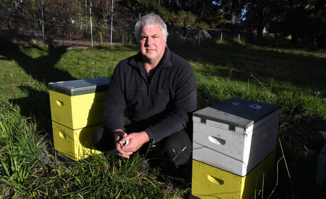 Amateur beekeeper Duncan Lockwood with his hives in Orange. 