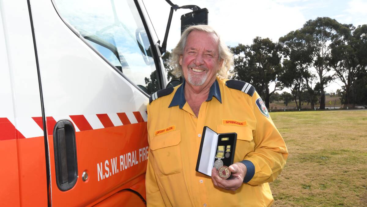 Senior Deputy Captain Geoff Olde with the National Emergency Medal 