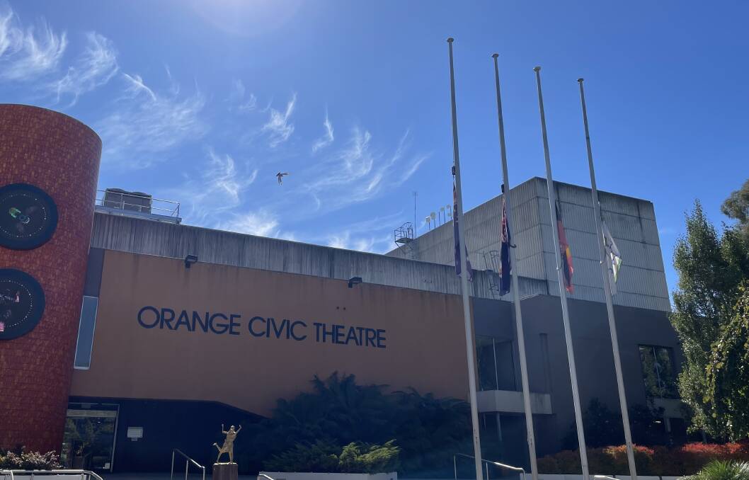Orange flags at half-mast after Bondi stabbing. Picture by William Davis
