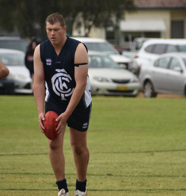 Co-coach of seniors men's AFL side, Justin Kelly getting ready to kick one of his six goals.