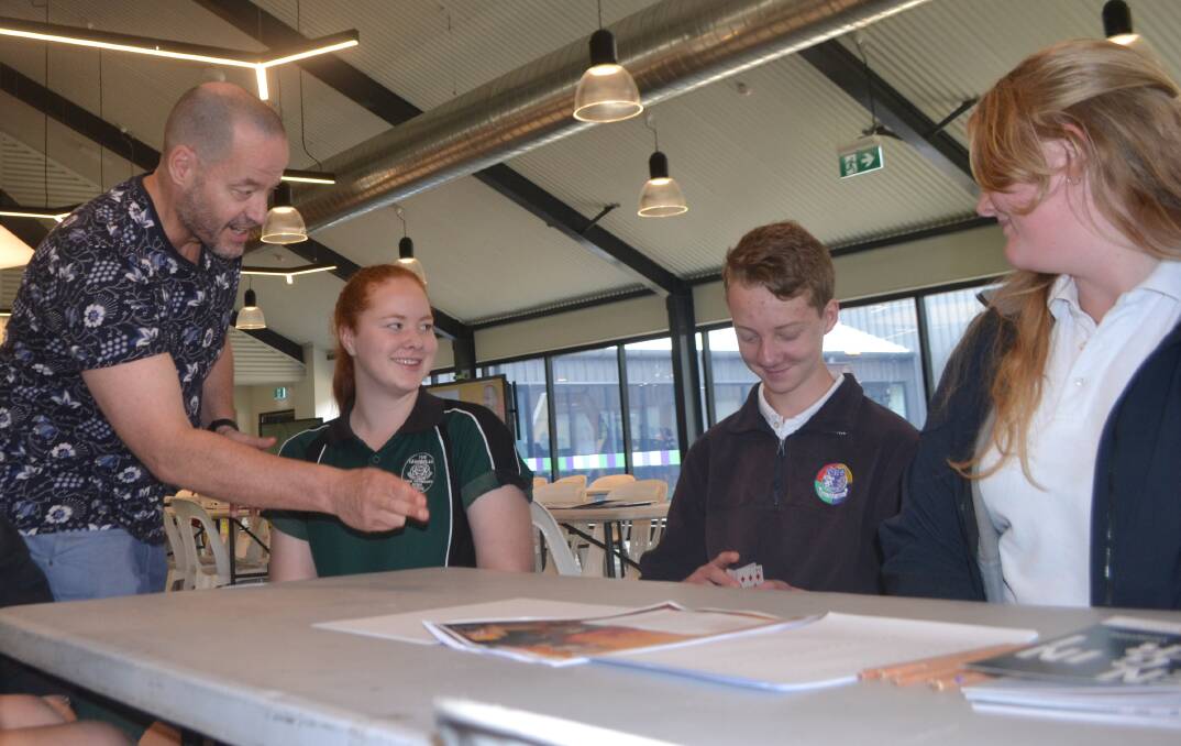 GIVE MATHS A GO: Mathematician Adam Spencer with Central West school students at CSU on Thursday. Photo: BRADLEY JURD