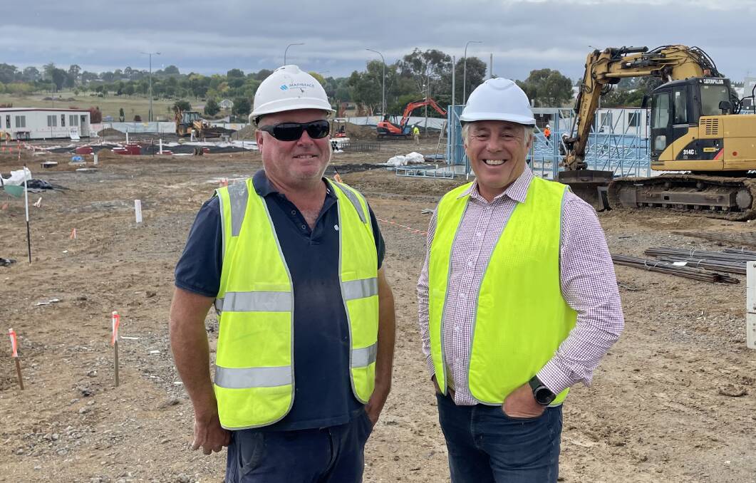 Mainbrace Constructions site manager Stuart Douglas and franchise of the new McDonald's Todd Bryant, at the site of the new restaurant on the Mitchell Highway. Picture by Bradley Jurd 