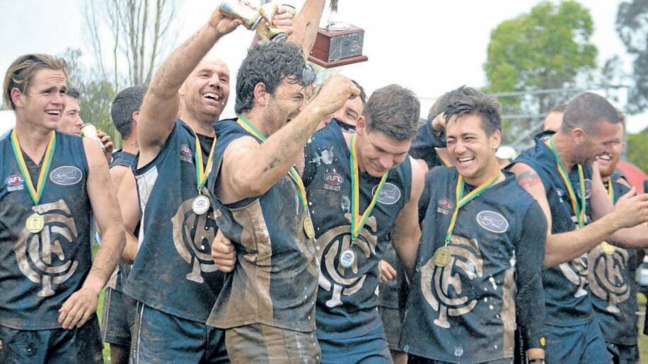 BIG DAY: The celebrations began quickly for the Cowra Blues after winning the 2016 Central West AFL grand final.