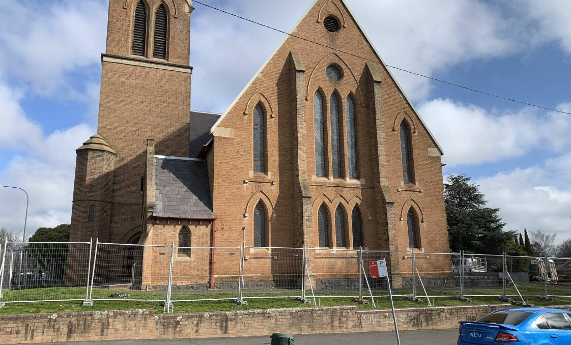 FENCED OFF: Estimates indicate around $450,000 will be required to fund reslating of the roof at the Holy Trinity Anglican Church.