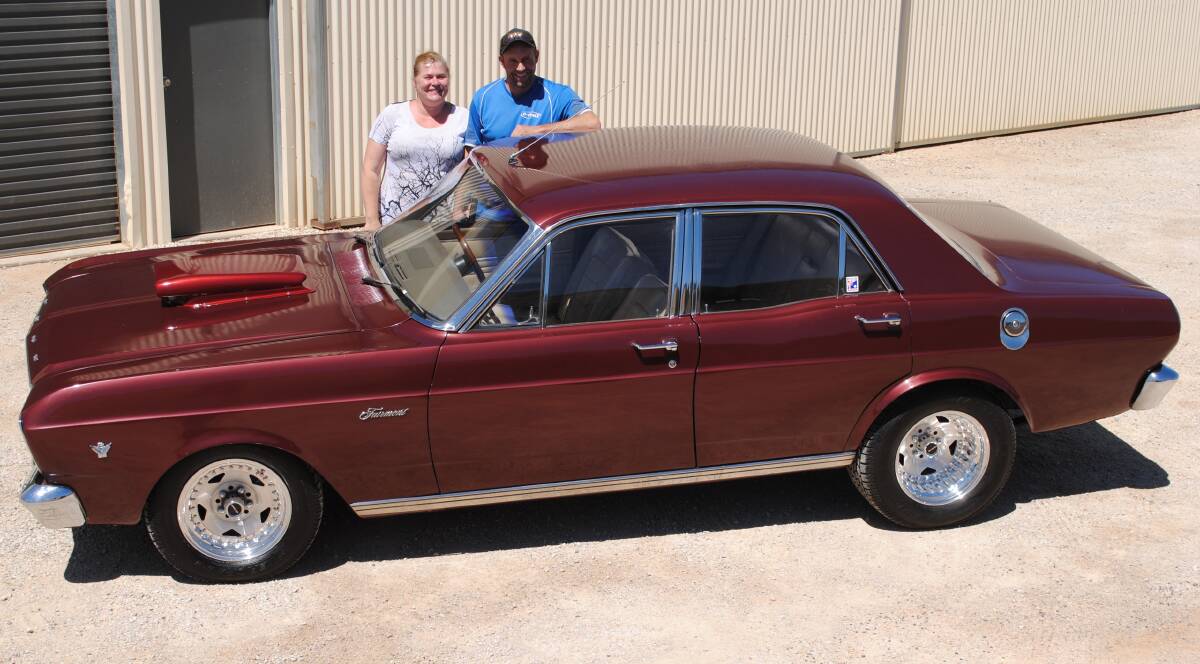 Joy to Drive: Toni Hugget from Molong owns this tough 1967 Ford XR Fairmont. She's pictured with husband Jason.